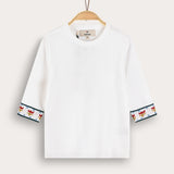 Knitted blouse with floral decoration - cream