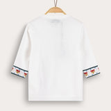 Knitted blouse with floral decoration - cream